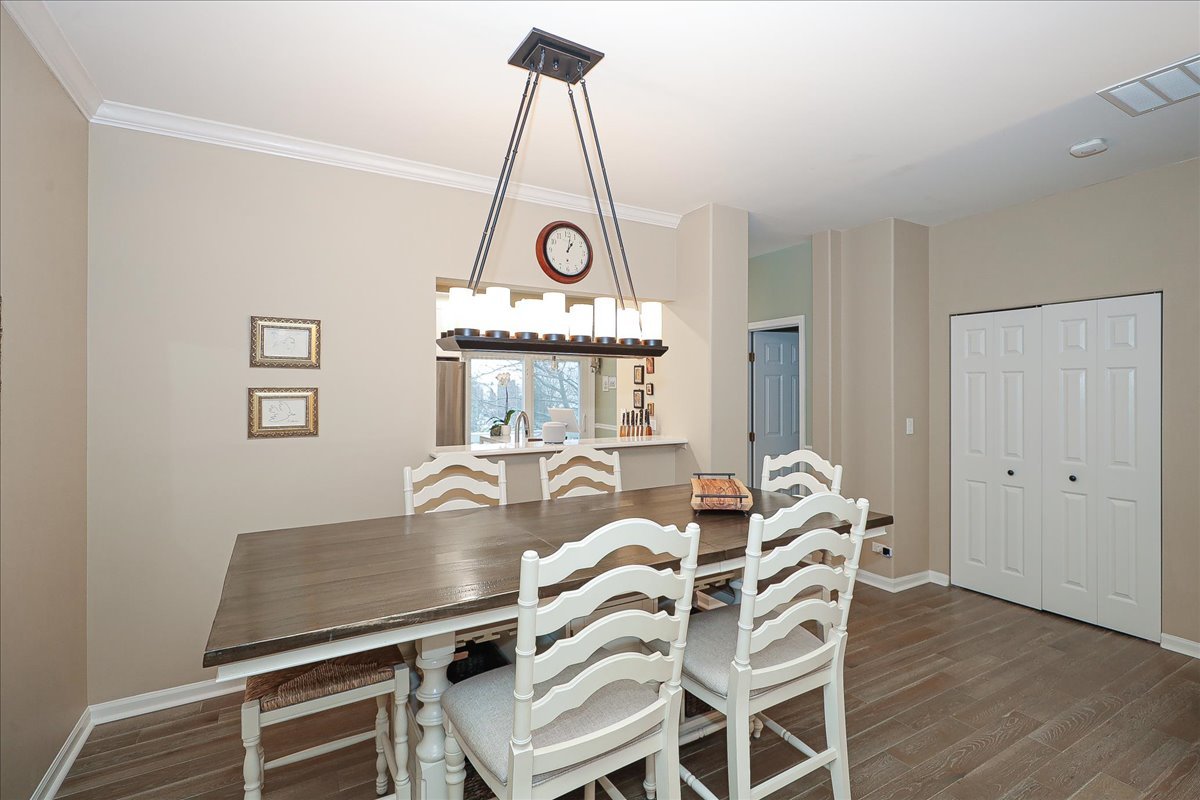3481 Ravinia Circle Aurora, IL 60504 - Photo 6 of 28 a view of a dining room with furniture window and wooden floor