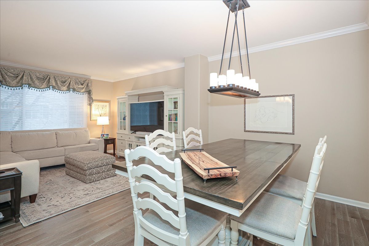3481 Ravinia Circle Aurora, IL 60504 - Photo 7 of 28 a living room with furniture and a chandelier