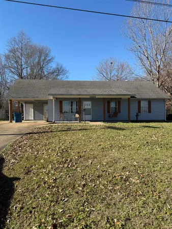 front view of a house with a yard