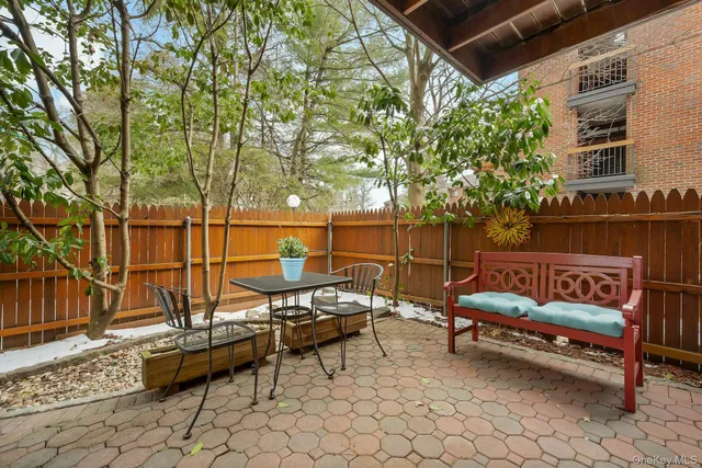 a blue bench sitting in front of a building