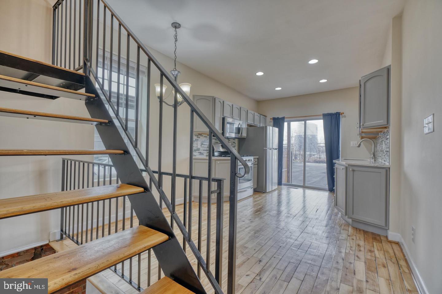 1754 Clarkson Street Baltimore, MD 21230 - Photo 18 of 35 a view of staircase with wooden floor and stairs