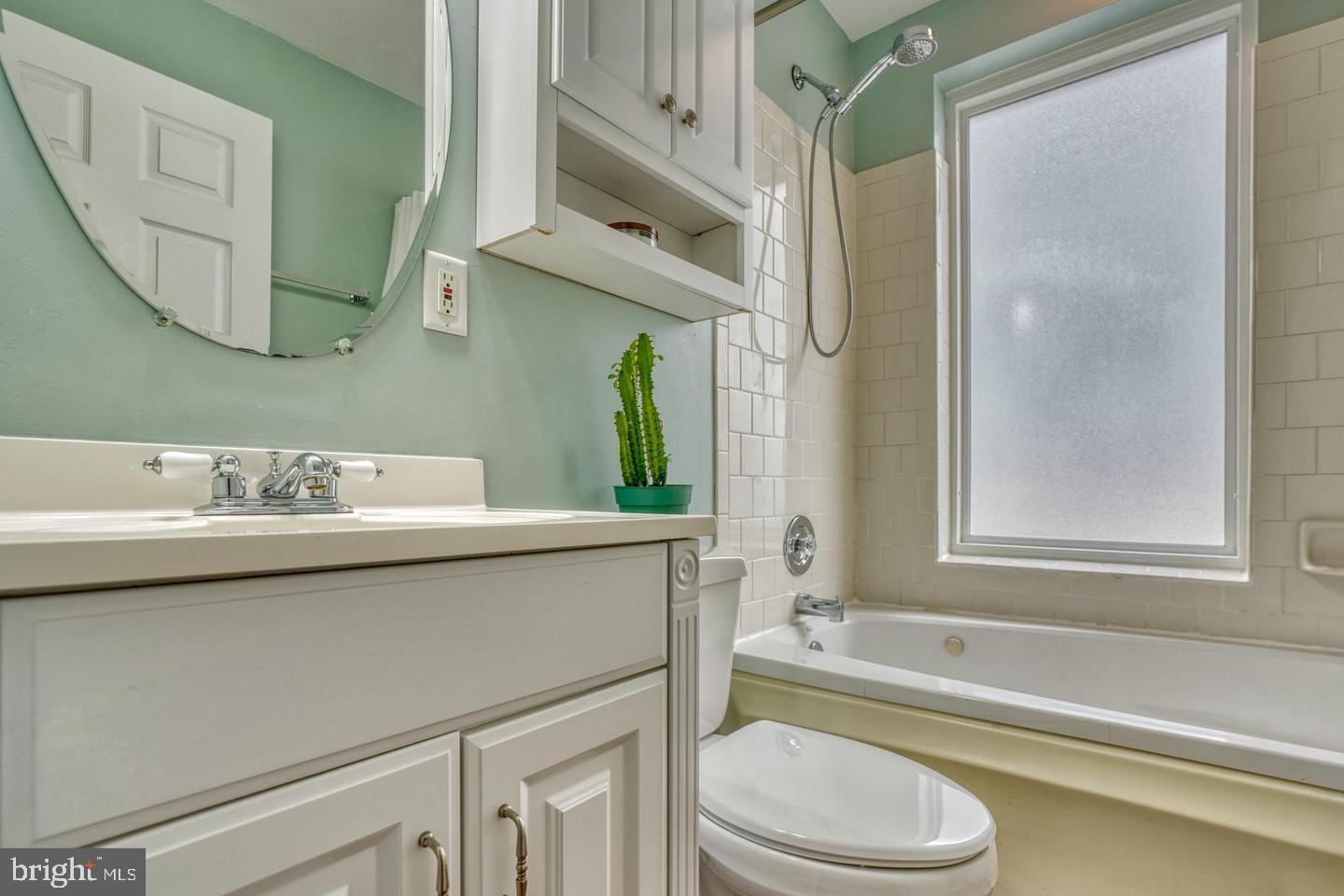 1754 Clarkson Street Baltimore, MD 21230 - Photo 24 of 35 a bathroom with a sink a toilet and a bathtub