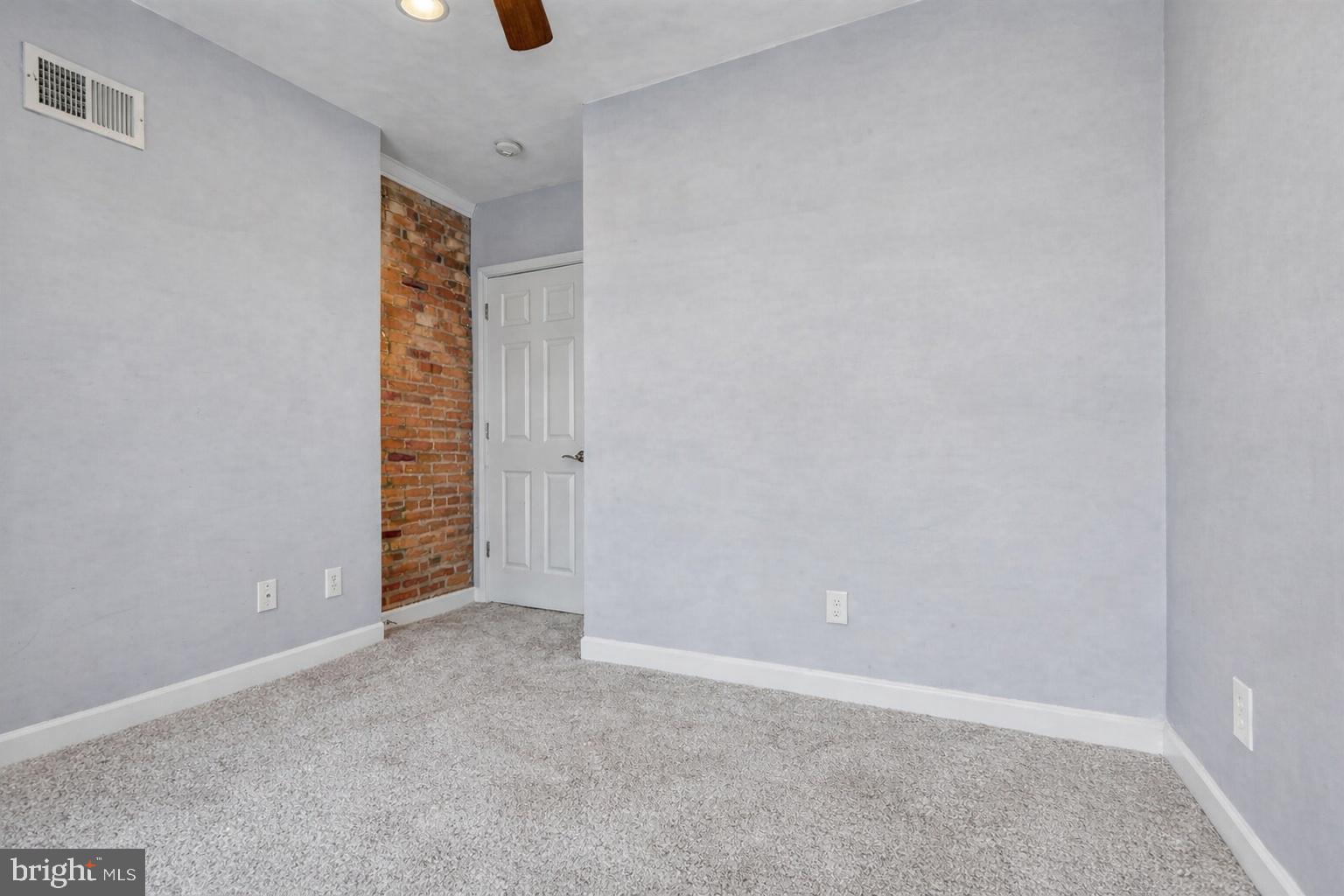1754 Clarkson Street Baltimore, MD 21230 - Photo 25 of 35 an empty room with windows