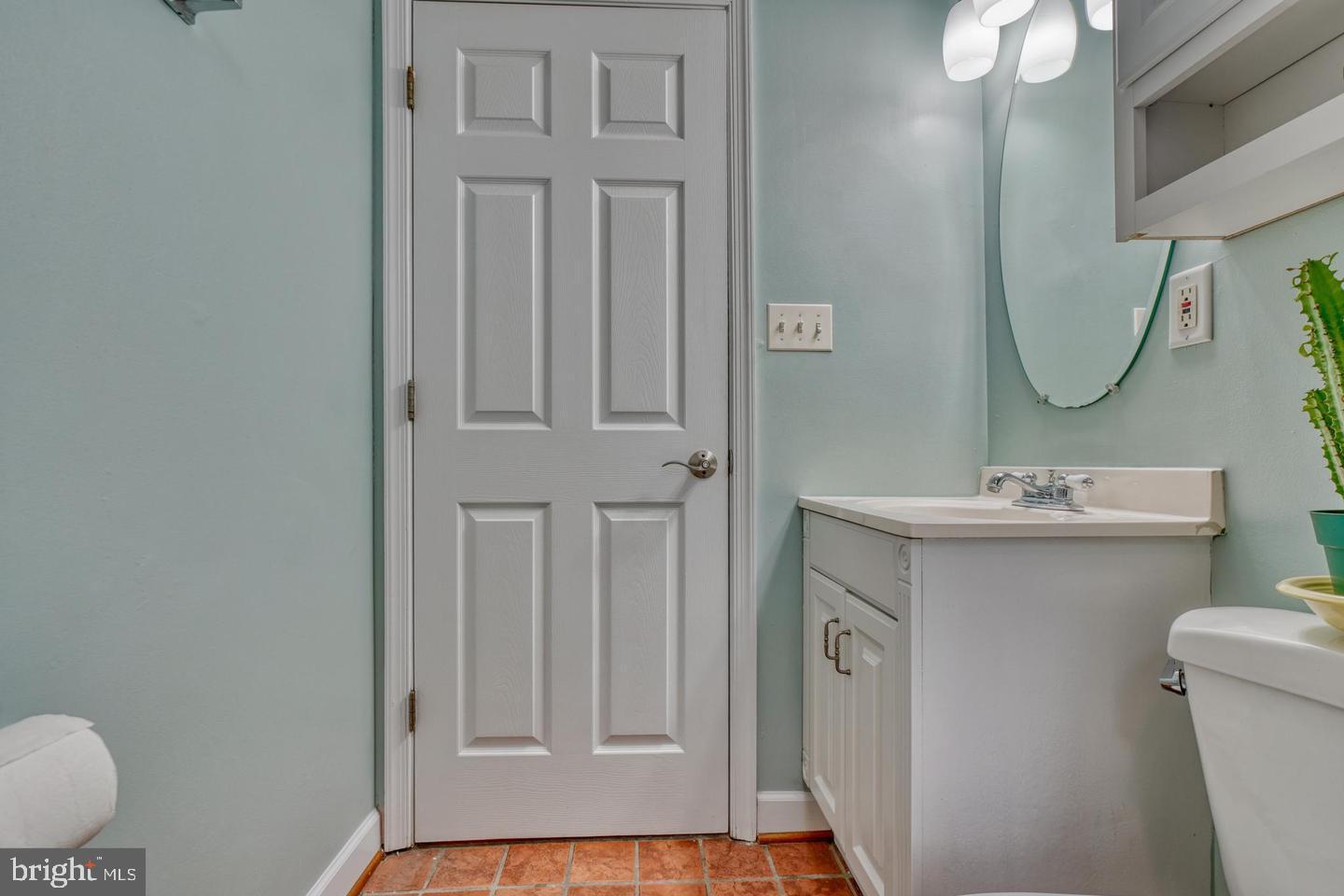1754 Clarkson Street Baltimore, MD 21230 - Photo 29 of 35 a bathroom with a sink mirror vanity and toilet