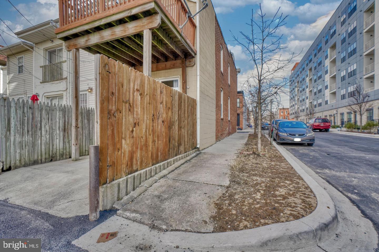 1754 Clarkson Street Baltimore, MD 21230 - Photo 33 of 35 a view of a car park in front of a house