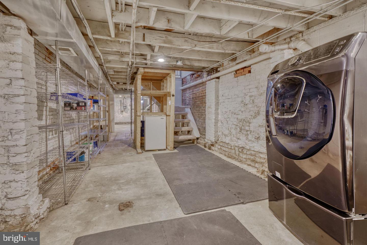 1754 Clarkson Street Baltimore, MD 21230 - Photo 34 of 35 a utility room with dryer and washer