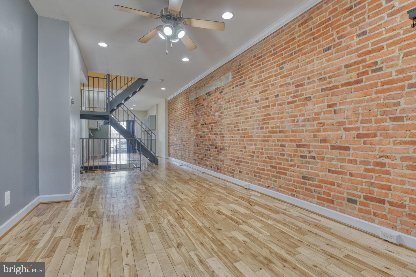 1754 Clarkson Street Baltimore, MD 21230 - Photo 6 of 35 a view of hallway with wooden floor