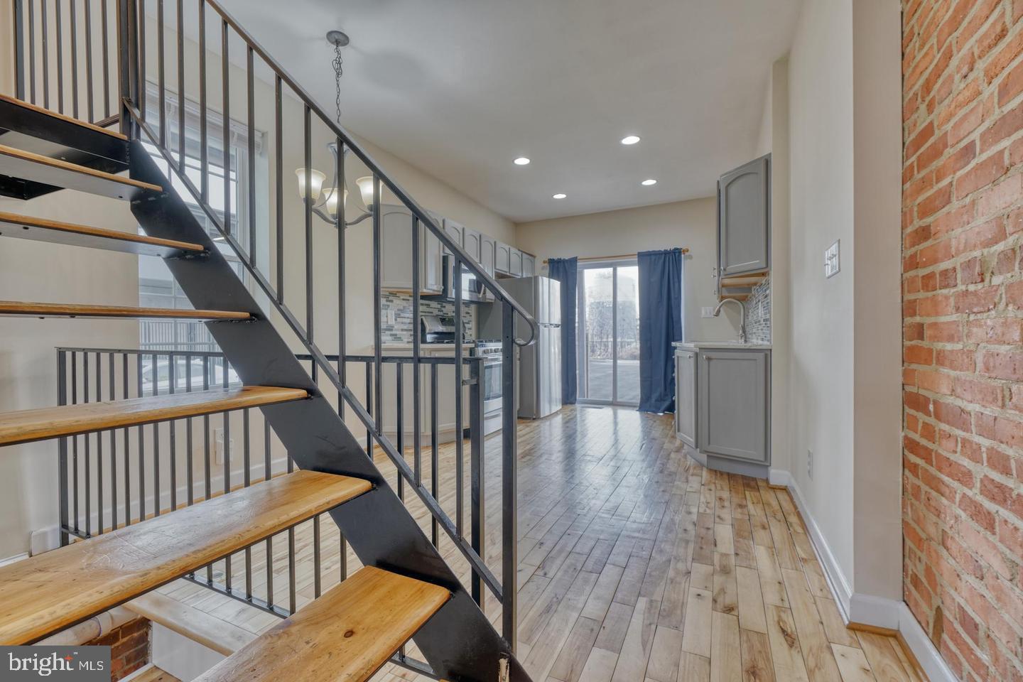 1754 Clarkson Street Baltimore, MD 21230 - Photo 9 of 35 a view of entryway with wooden floor and stairs