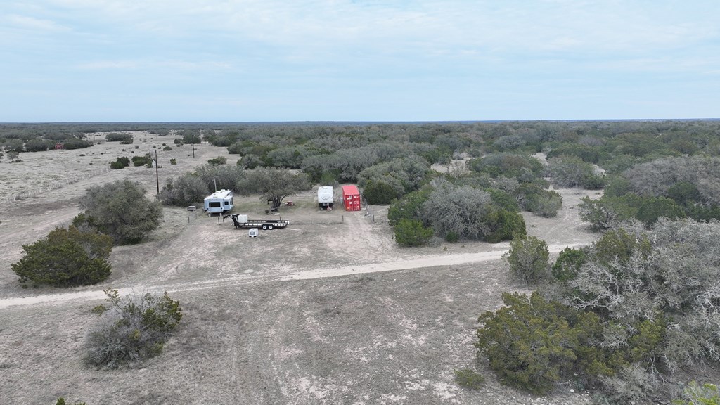 Lot 2 Hwy 55 Rocksprings Tx 78880 Rocksprings, TX 78880 - Photo 6 of 12 a view of a dry yard with wooden fence