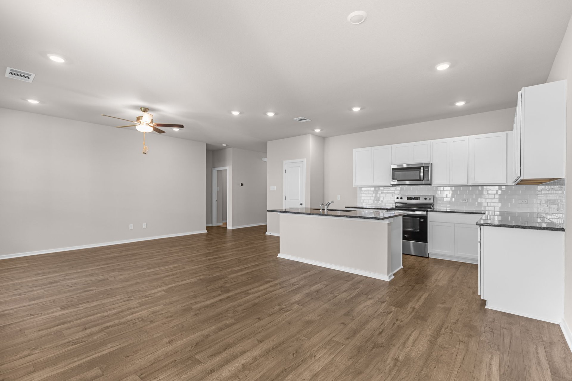 173 Sleep Hollow Jarrell, TX 76537 - Photo 17 of 29 From Family Room to Open Concept Kitchen
