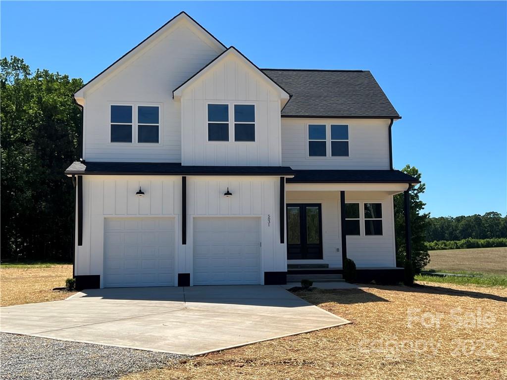 5817 Laney Rogers Road, Unit 5 Monroe, NC 28112 - Photo 1 of 14 a view of a house with a yard