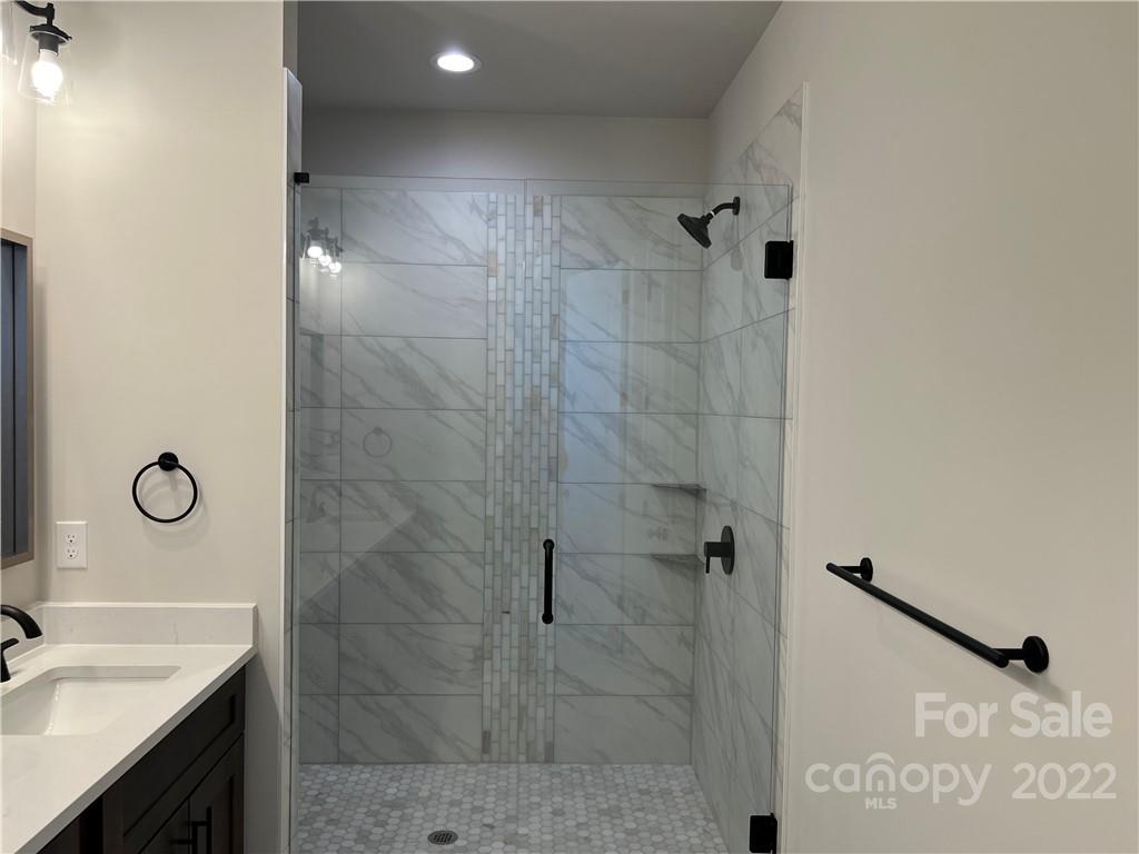 5817 Laney Rogers Road, Unit 5 Monroe, NC 28112 - Photo 11 of 14 a bathroom with a sink and a mirror
