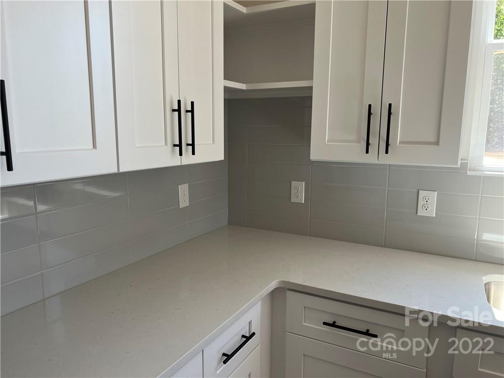5817 Laney Rogers Road, Unit 5 Monroe, NC 28112 - Photo 4 of 14 a view of cabinets and window