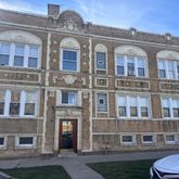 a front view of a building with yard