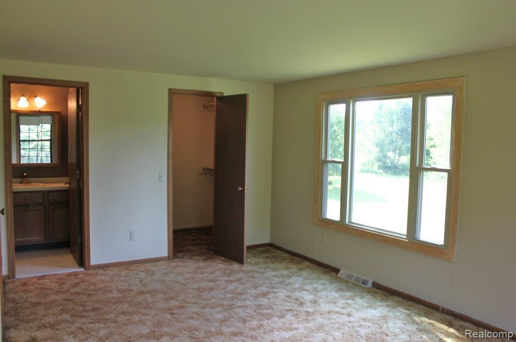 19115 Tipsico Lake Road Fenton, MI 48430 - Photo 16 of 26 with Walk In Closet and adjoining Bath