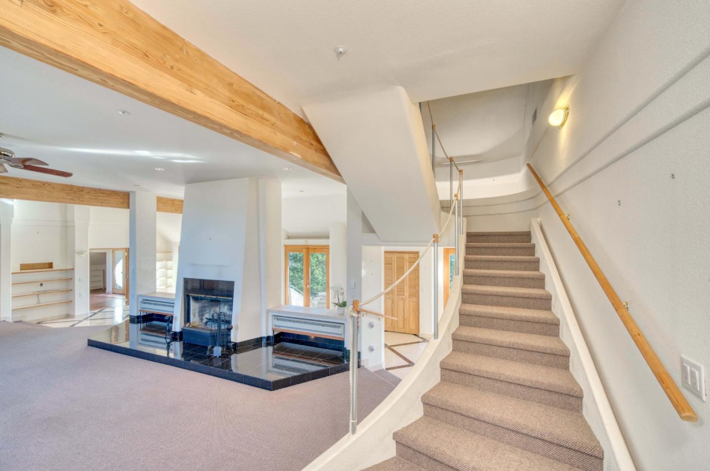 775 Alta Vista Road Montara, CA 94037 - Photo 14 of 27 a living room with furniture and a fireplace