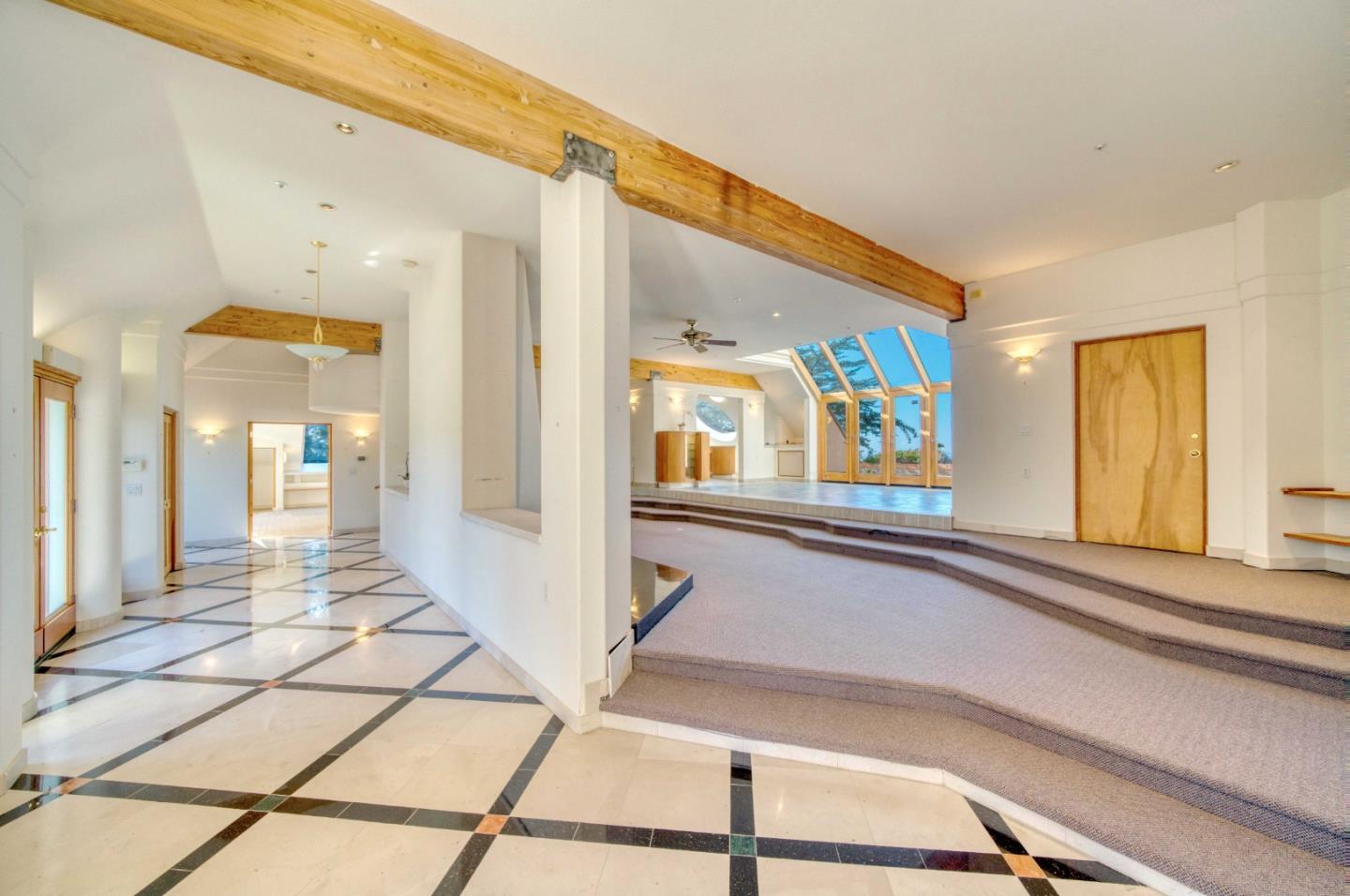 775 Alta Vista Road Montara, CA 94037 - Photo 16 of 27 a view of a hallway with windows