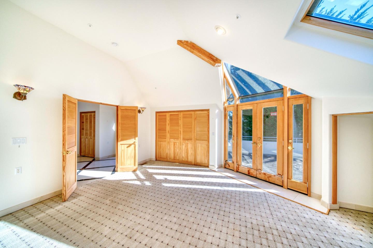 775 Alta Vista Road Montara, CA 94037 - Photo 18 of 27 a view of a bedroom with wooden floor and windows