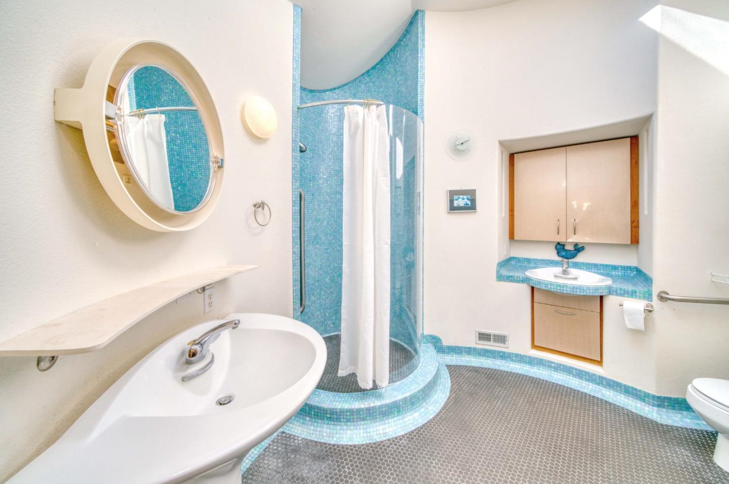 775 Alta Vista Road Montara, CA 94037 - Photo 20 of 27 a bathroom with a sink and a mirror