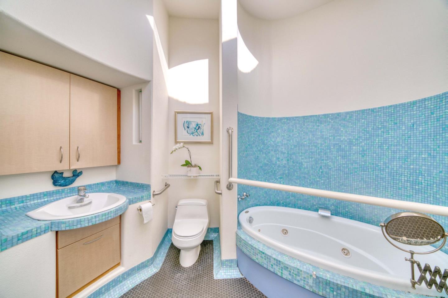 775 Alta Vista Road Montara, CA 94037 - Photo 21 of 27 a bathroom with a granite countertop sink mirror vanity bathtub and a toilet