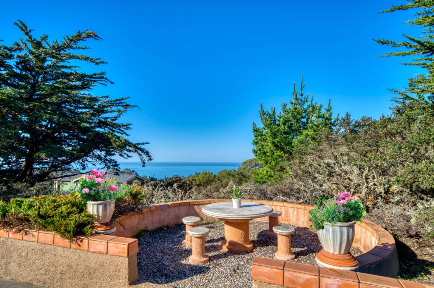 775 Alta Vista Road Montara, CA 94037 - Photo 3 of 27 a view of a chairs and table in a garden