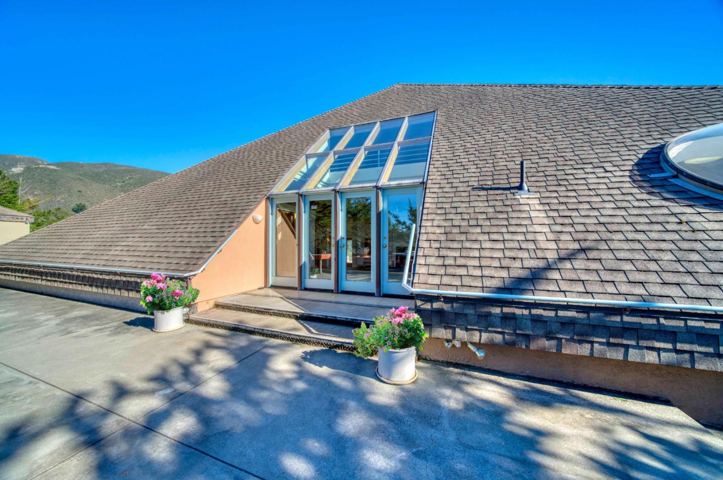 775 Alta Vista Road Montara, CA 94037 - Photo 4 of 27 a front view of a house with sitting area