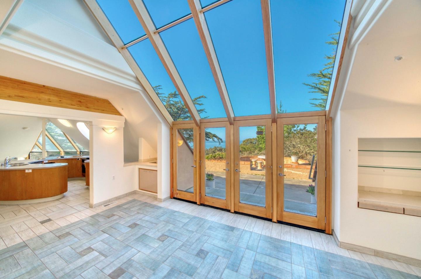 775 Alta Vista Road Montara, CA 94037 - Photo 6 of 27 a view of an empty room with wooden floor and windows