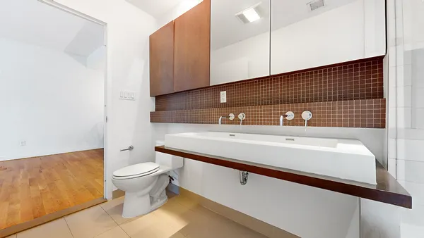 a bathroom with a sink a toilet and bathtub