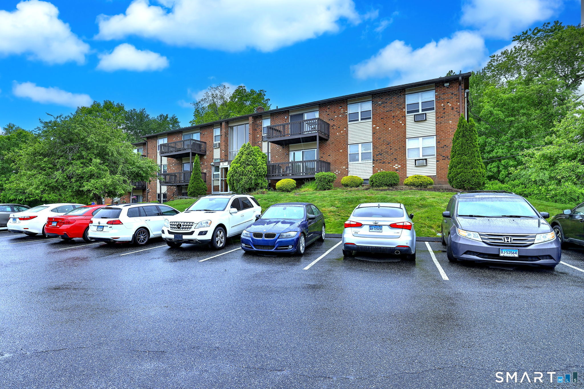 43 Balance Rock Road, Unit 11 Seymour, CT 06483 - Photo 2 of 40 a view of cars parked in front of a house
