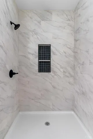 a picture of a bathroom with toilet and a shower