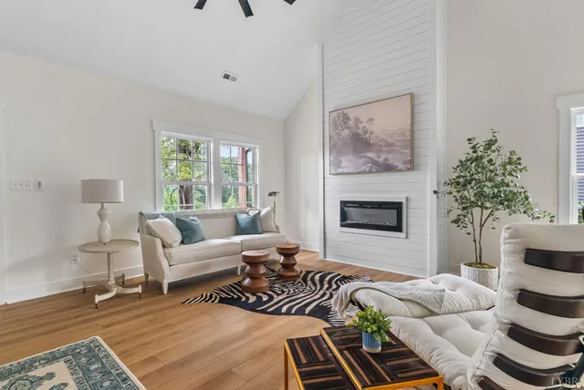 a bedroom with furniture and a fireplace
