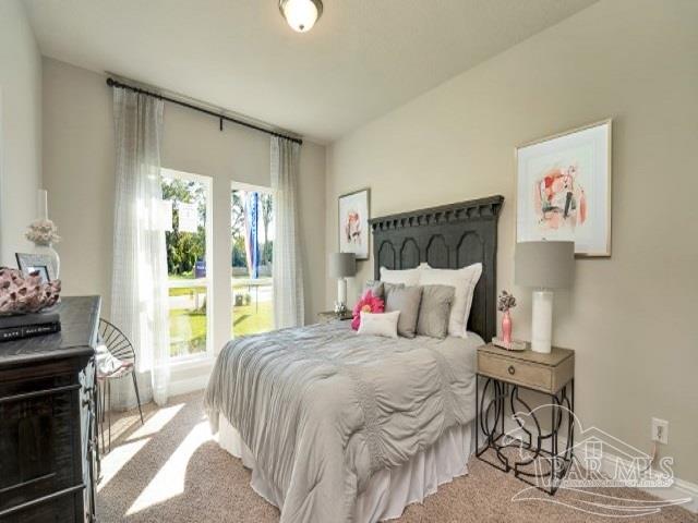 5636 Blake Lane Milton, FL 32571 - Photo 13 of 27 a bedroom with a bed and glass window