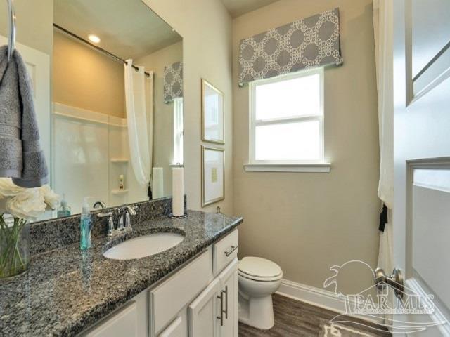 5636 Blake Lane Milton, FL 32571 - Photo 15 of 27 a bathroom with a granite countertop sink and a mirror