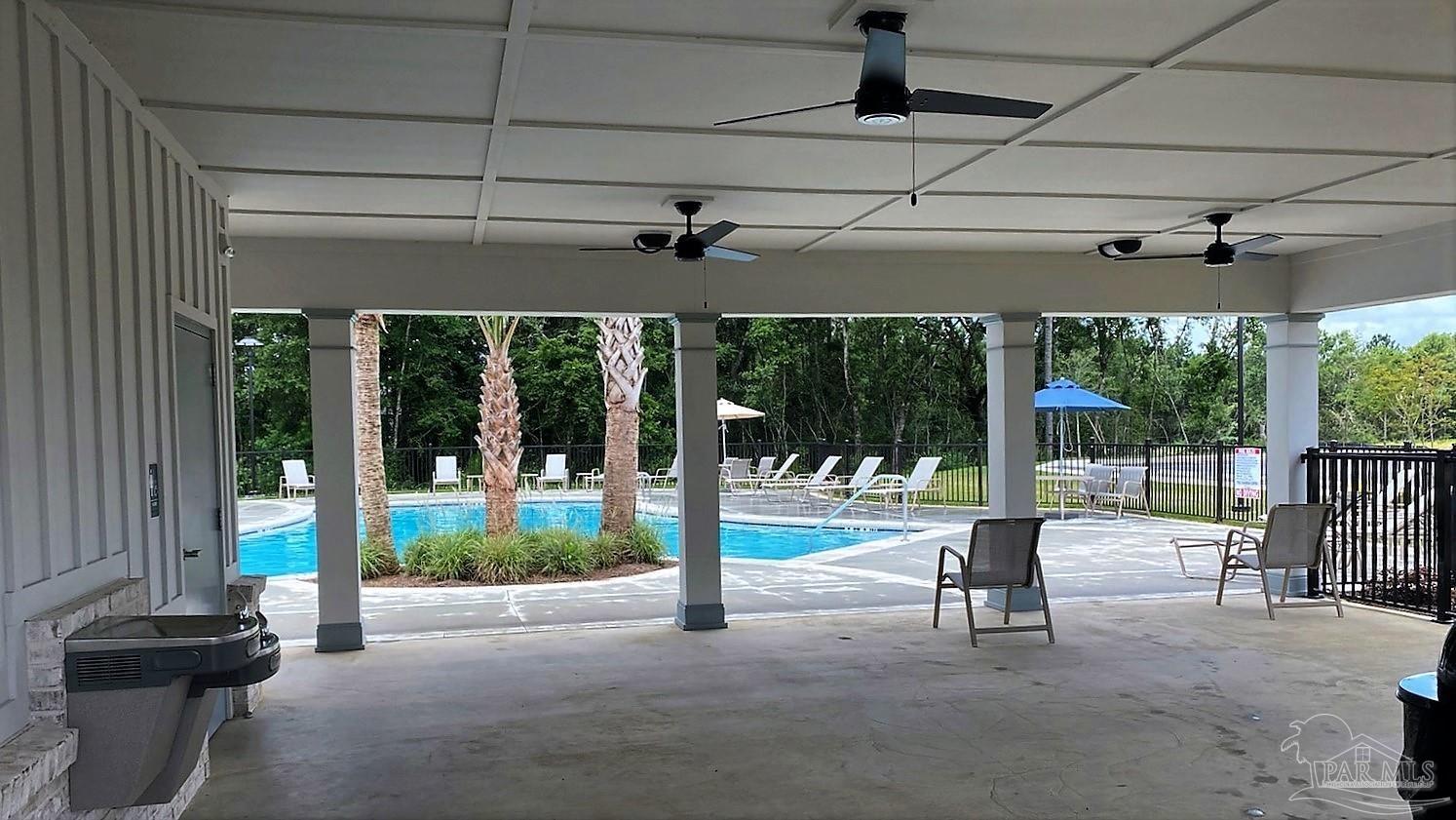 5636 Blake Lane Milton, FL 32571 - Photo 20 of 27 a view of a building with porch and wooden floor