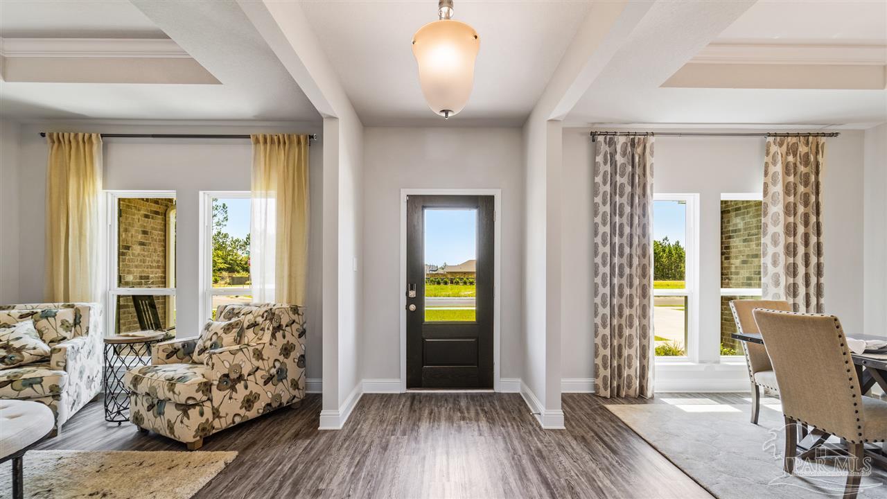 5636 Blake Lane Milton, FL 32571 - Photo 6 of 27 a view of a livingroom with furniture and windows