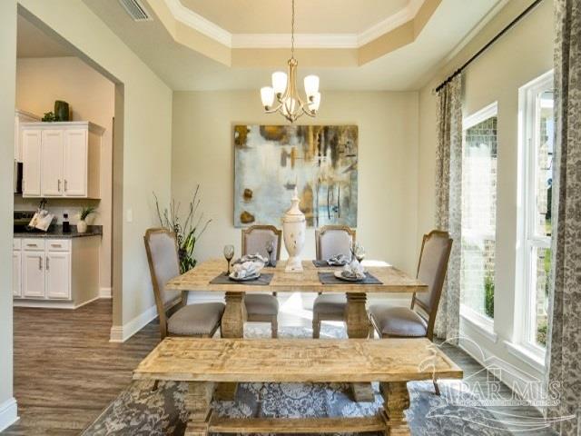 5636 Blake Lane Milton, FL 32571 - Photo 8 of 27 a view of a dining room with furniture window and wooden floor