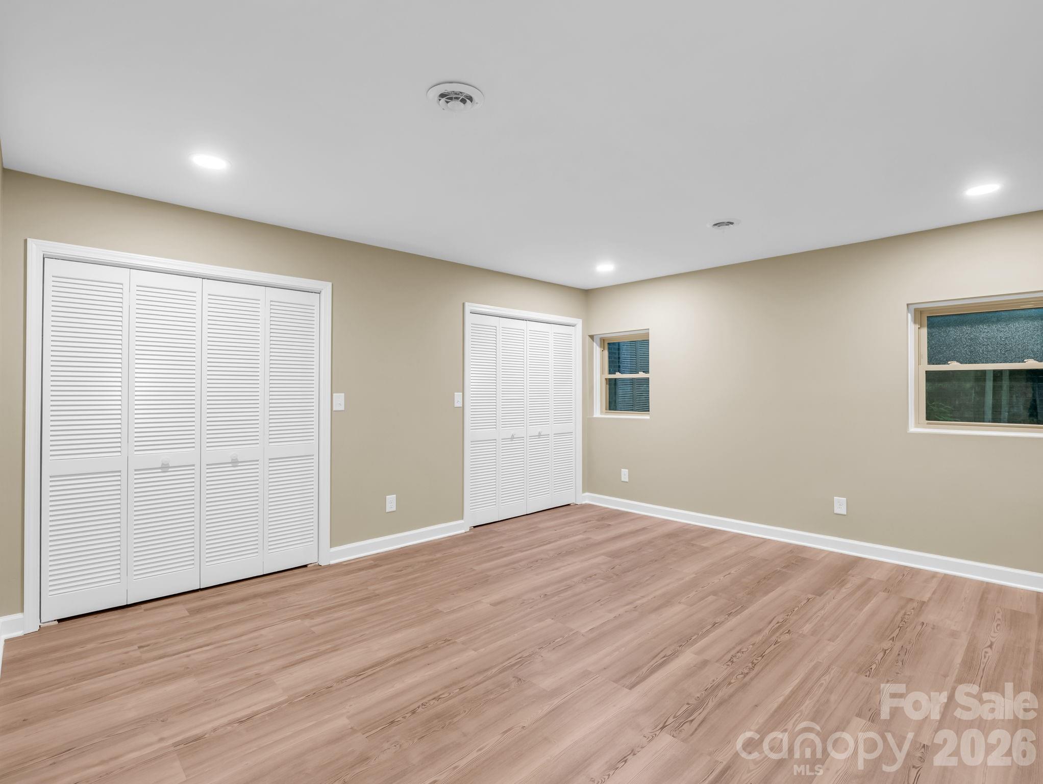 44 Jervey Road, Unit 4C Tryon, NC 28782 - Photo 14 of 35 a view of an empty room with wooden floor and a window