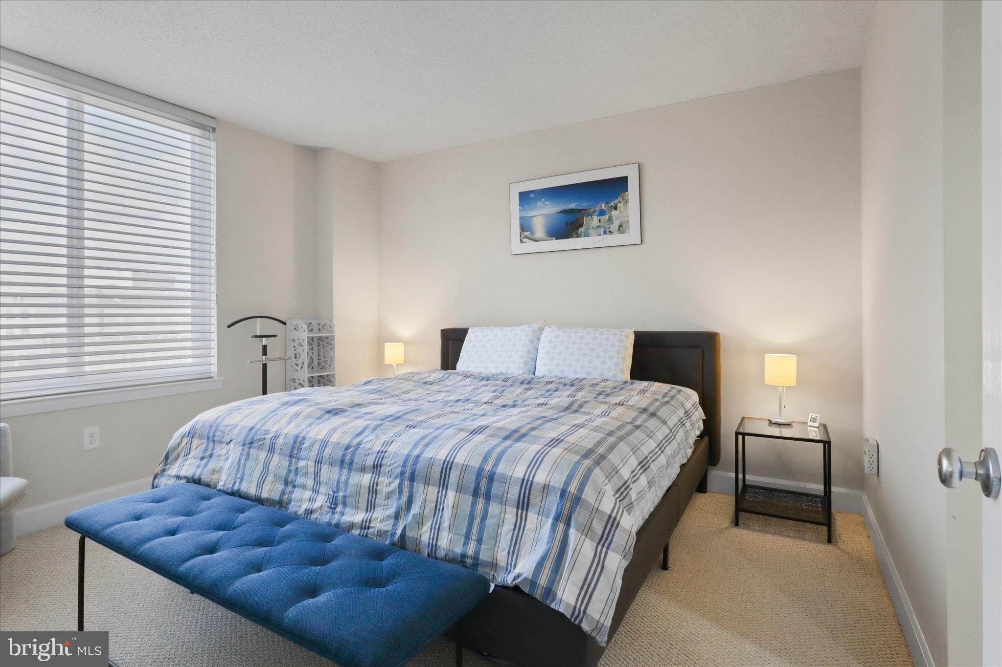 1220 North Fillmore Street, Unit 909 Arlington, VA 22201 - Photo 12 of 38 a bedroom with a bed and a window