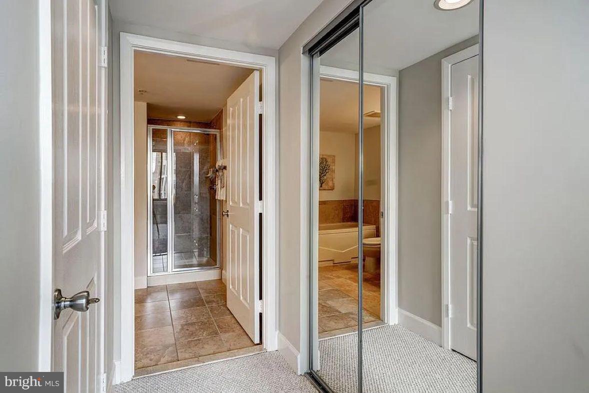 1220 North Fillmore Street, Unit 909 Arlington, VA 22201 - Photo 14 of 38 a view of a bathroom from a hallway