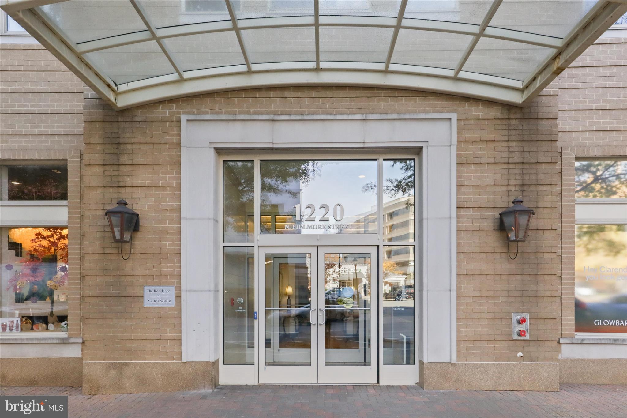 1220 North Fillmore Street, Unit 909 Arlington, VA 22201 - Photo 2 of 38 a front view of a building with a glass door