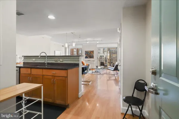 a kitchen with a table and chairs in it