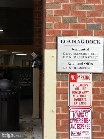 a front view of a building with sitting area