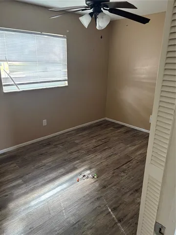 a view of room with window and hardwood floor