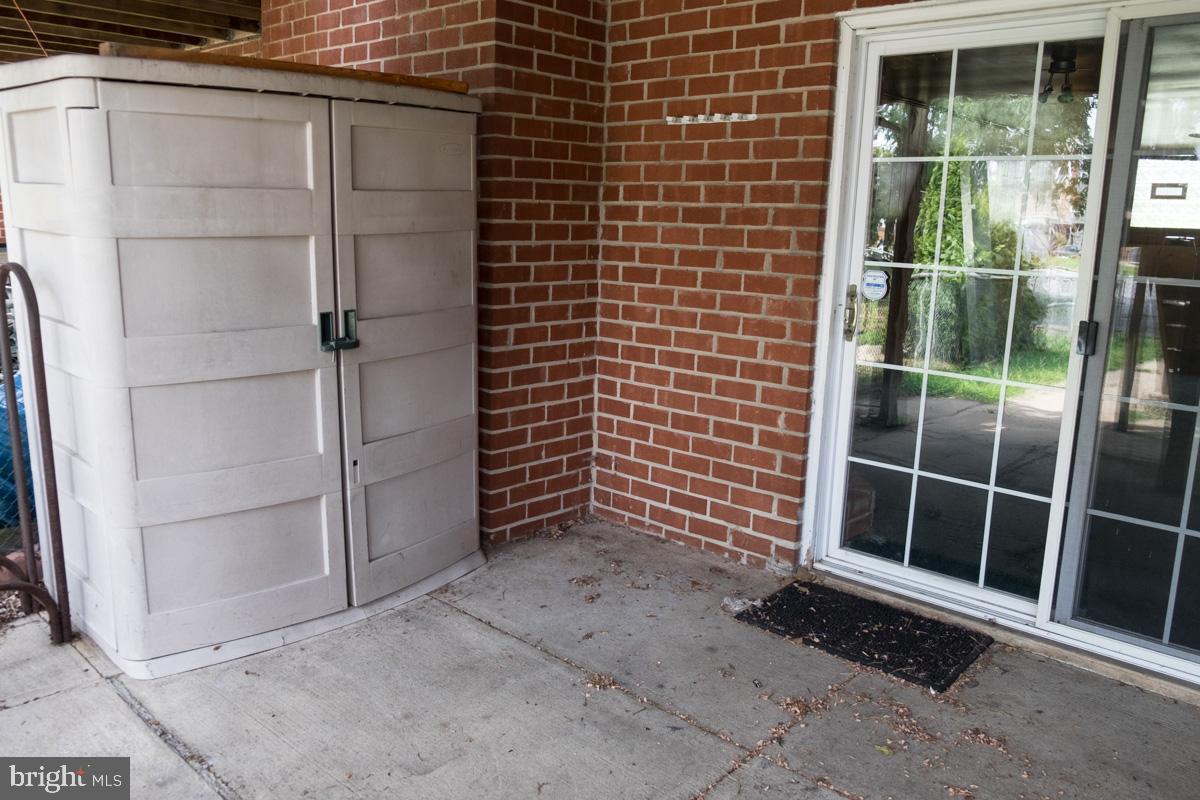 1597 Lynch Road Baltimore, MD 21222 - Photo 25 of 27 Rear covered patio (17' x 10') with shed