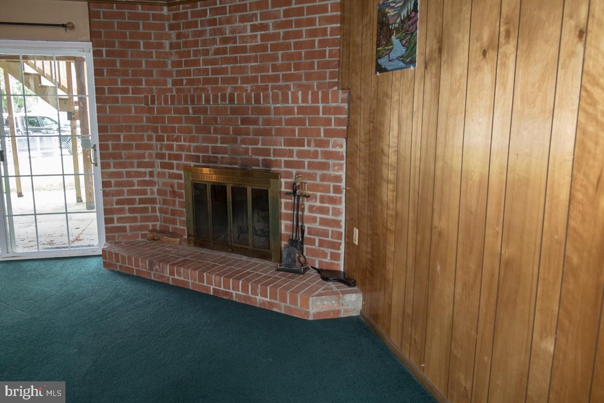 1597 Lynch Road Baltimore, MD 21222 - Photo 8 of 27 Corner wood-burning fireplace