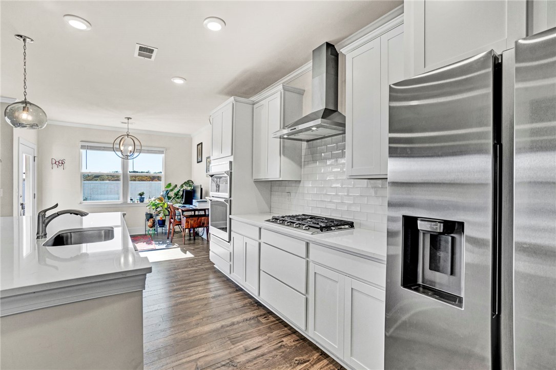 142 Juniper Hill Drive Easley, SC 29642 - Photo 12 of 47 This modern kitchen features a spacious island and contemporary stainless steel appliances.
