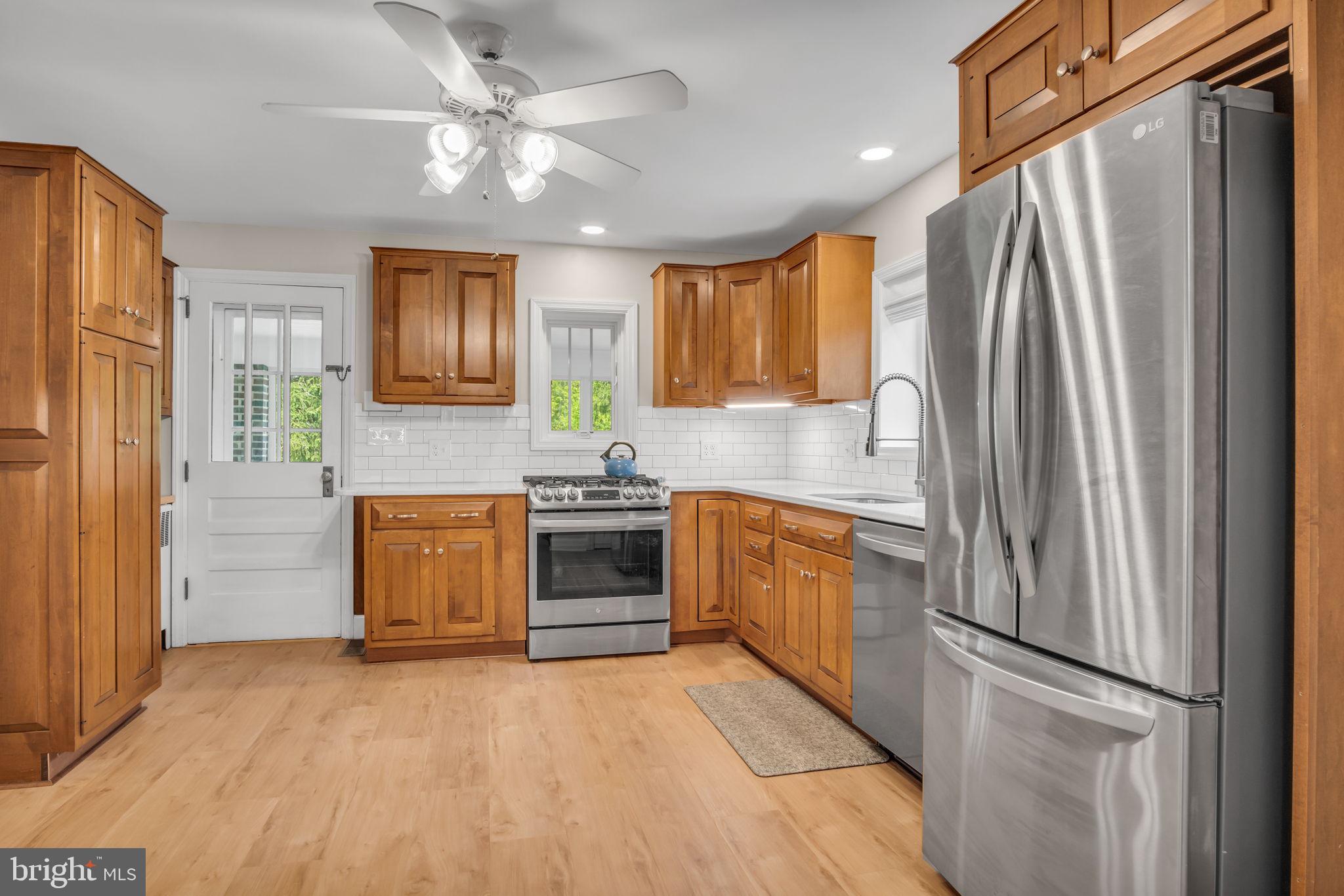 1037 Siddonsburg Road Lewisberry, PA 17339 - Photo 12 of 61 a kitchen with granite countertop a refrigerator stove and sink