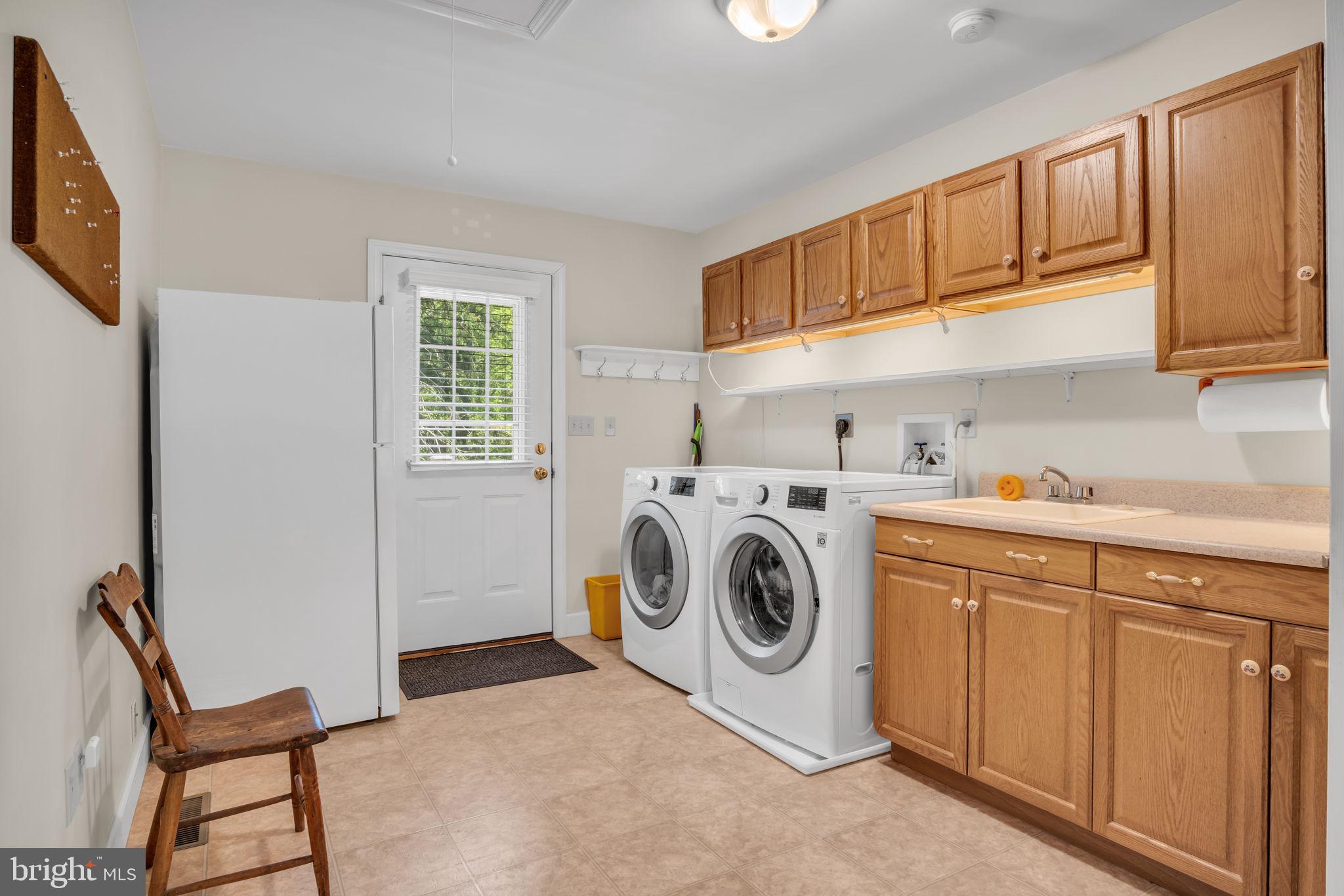 1037 Siddonsburg Road Lewisberry, PA 17339 - Photo 19 of 61 a utility room with sink dryer and washer