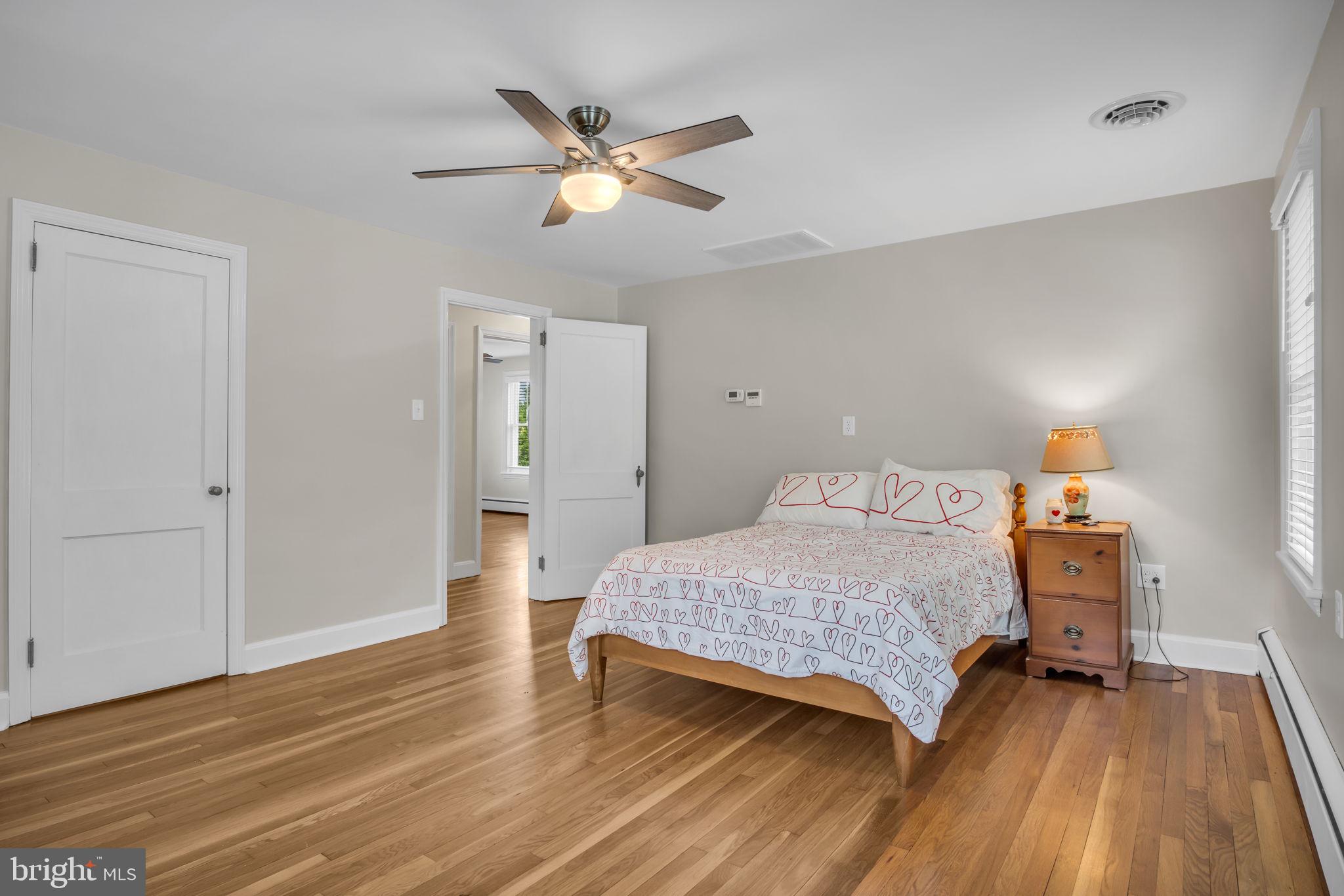 1037 Siddonsburg Road Lewisberry, PA 17339 - Photo 21 of 61 a bedroom with a bed and wooden floor