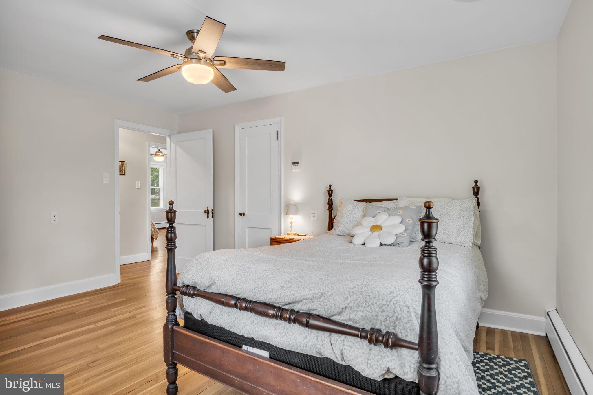1037 Siddonsburg Road Lewisberry, PA 17339 - Photo 24 of 61 a bedroom with a bed and a chandelier